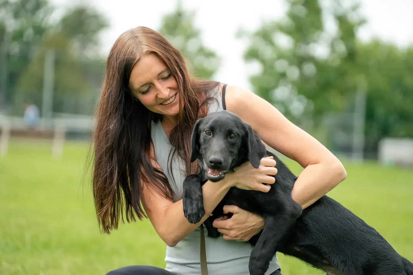 A K9aholics trainer working a dog through obedience in Virginia Beach